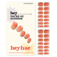 Heyhae semi-cured nail strips in orange ombre for salon-quality color under sun.