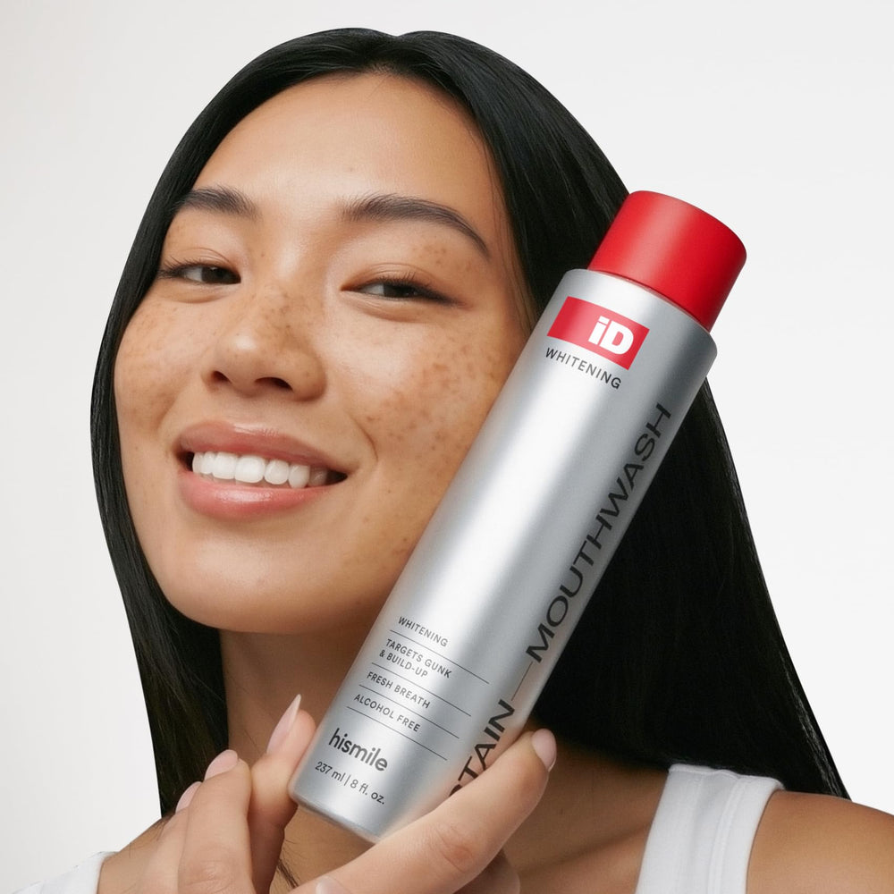 Person using HISMILE mouthwash to rinse for fresher breath and cleaner soft tissues