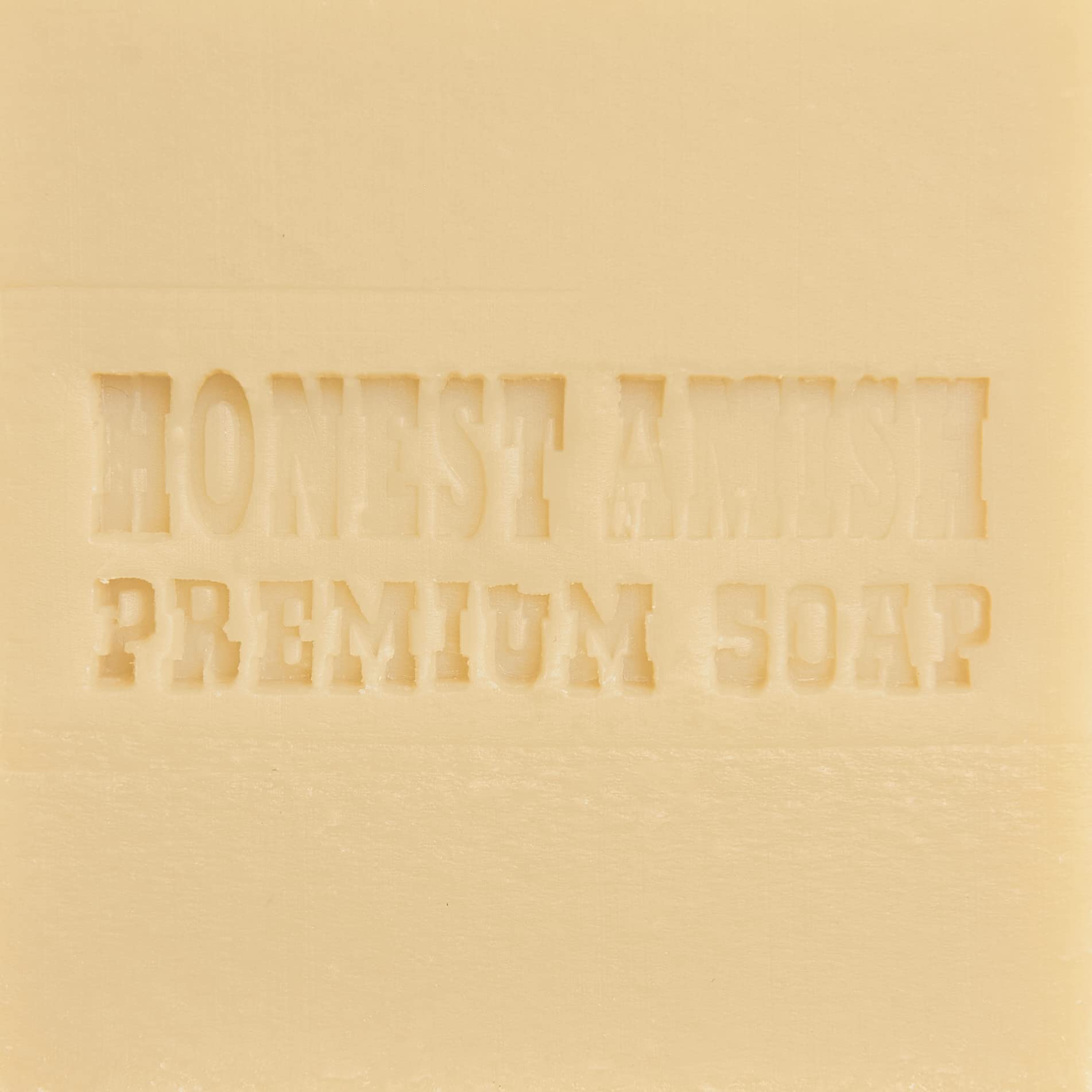 Honest Amish Lavender and Clove Soap Bar held in hand conveys gentle cleansing and ritual use.