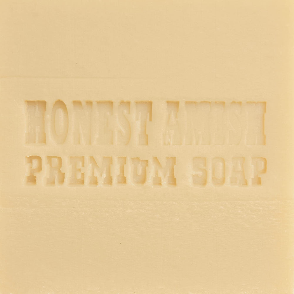 Honest Amish Lavender and Clove Soap Bar held in hand conveys gentle cleansing and ritual use.