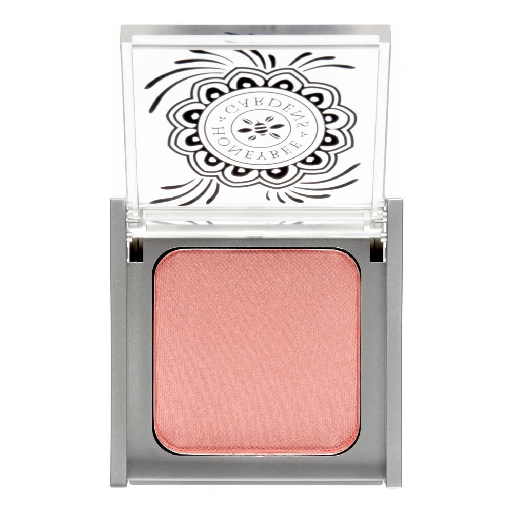 Honeybee Gardens blush Rendezvous powder close-up showing rich pigment for a natural rosy glow.