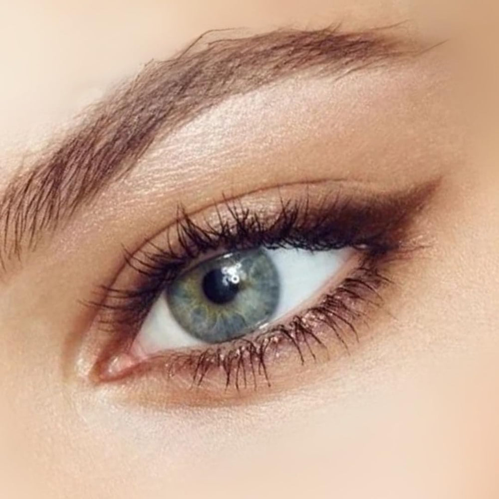 Honeybee Gardens Effortless Eyeliner Pencil Belgian Chocolate on upper lash line for defined eyes.
