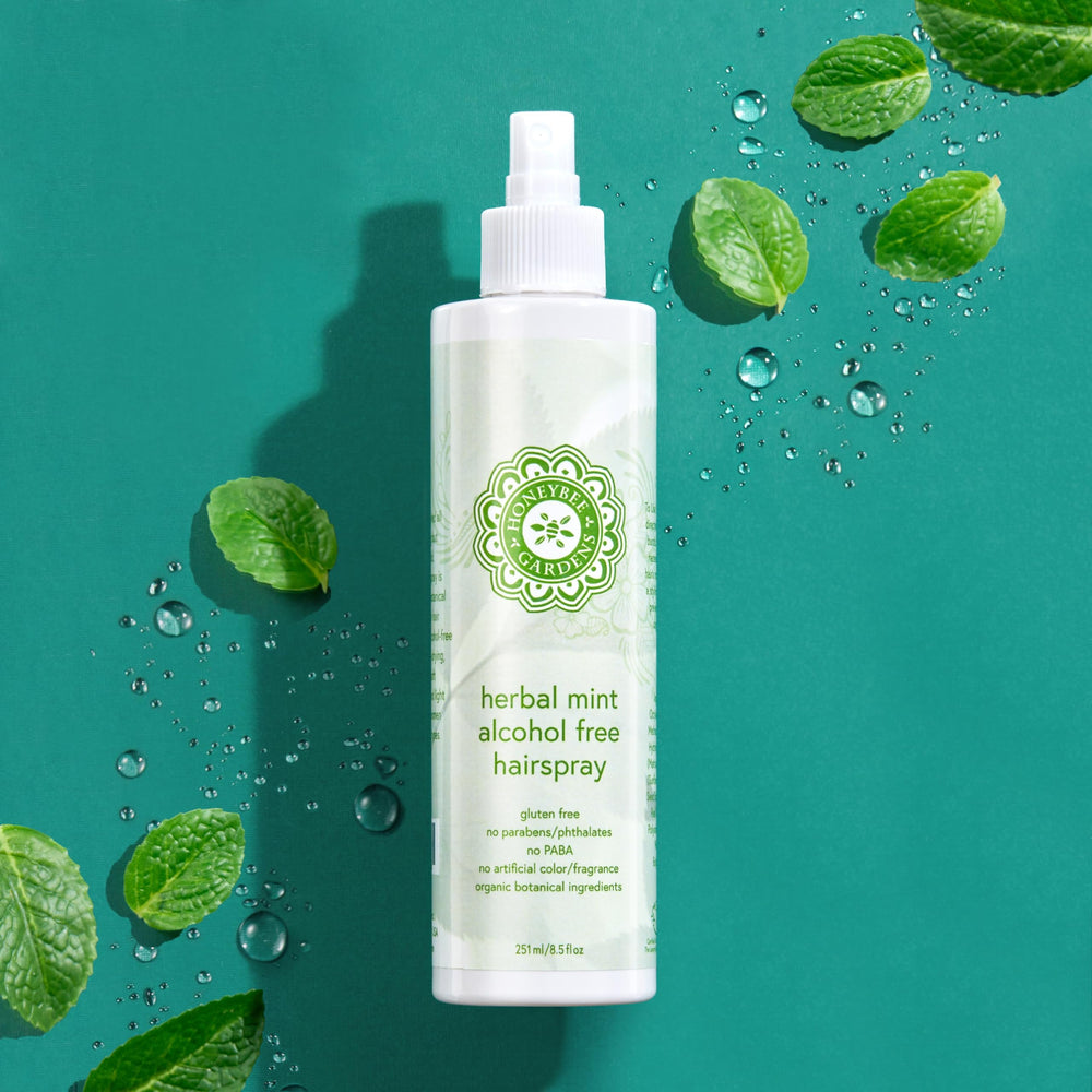 Honeybee Gardens Hair Spray Herbal Mint packaging closeup shows clean, alcohol-free formula.