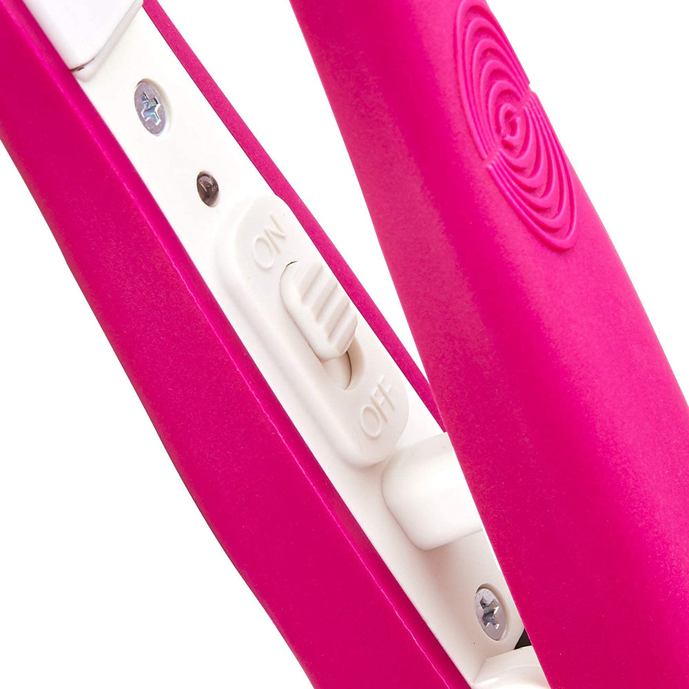 Hot Beauty Mini Flat Iron pink in hand for travel-friendly styling