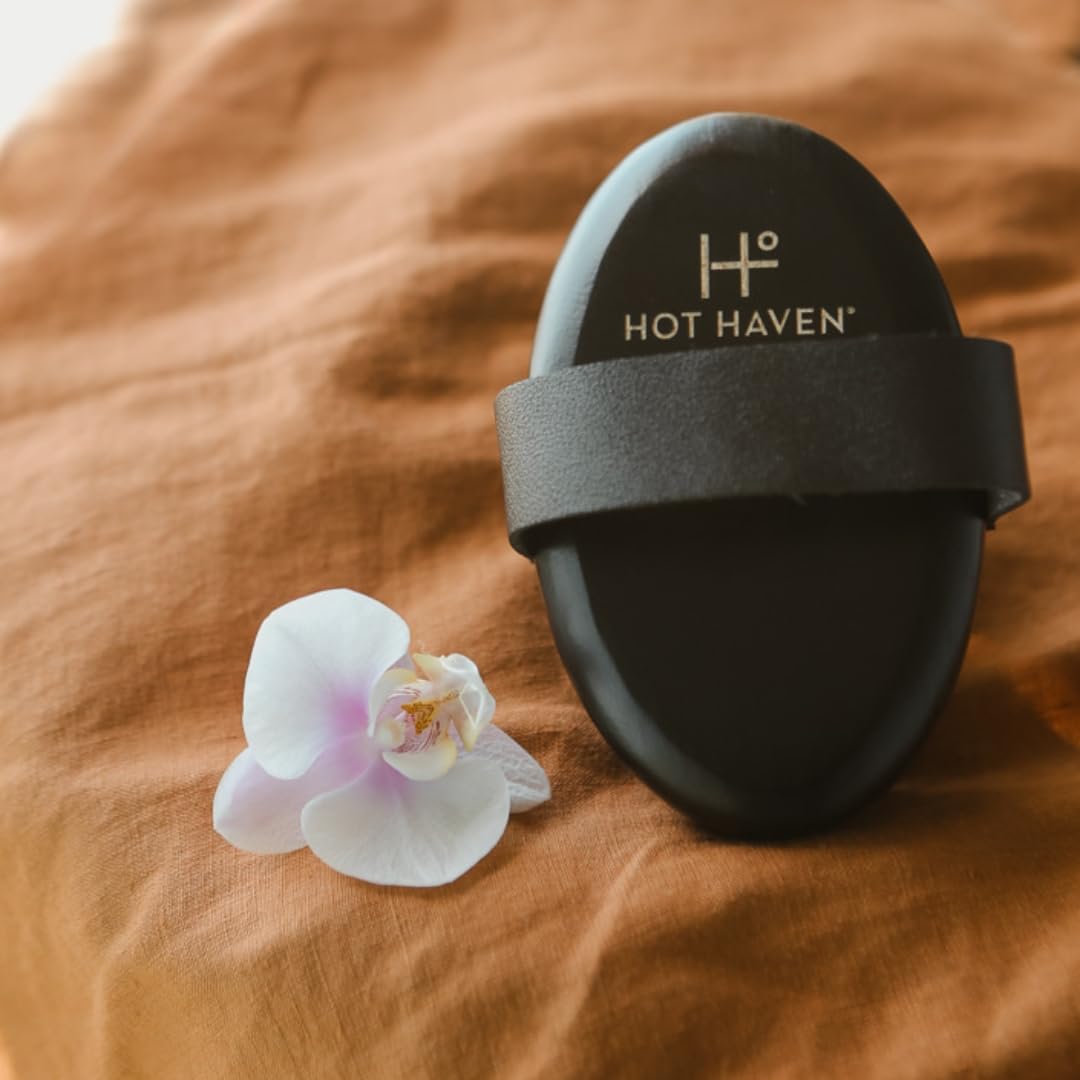 HOT HAVEN cellulite-smoothing brush in-use action for smoother skin.