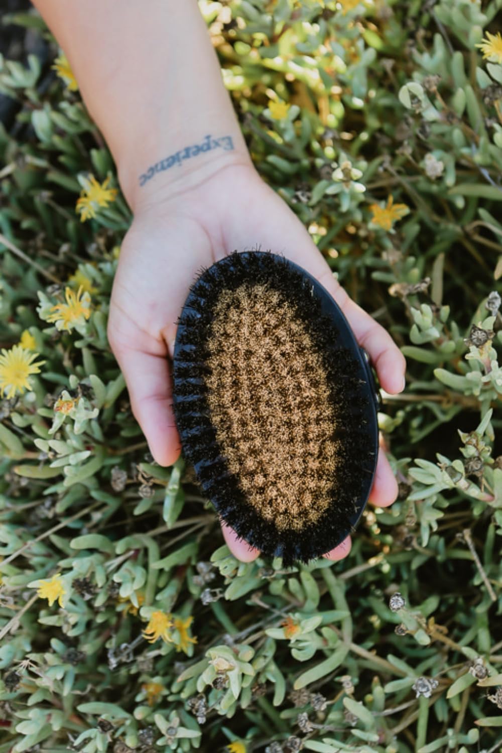 HOT HAVEN dry brush in action for radiant skin exfoliation.