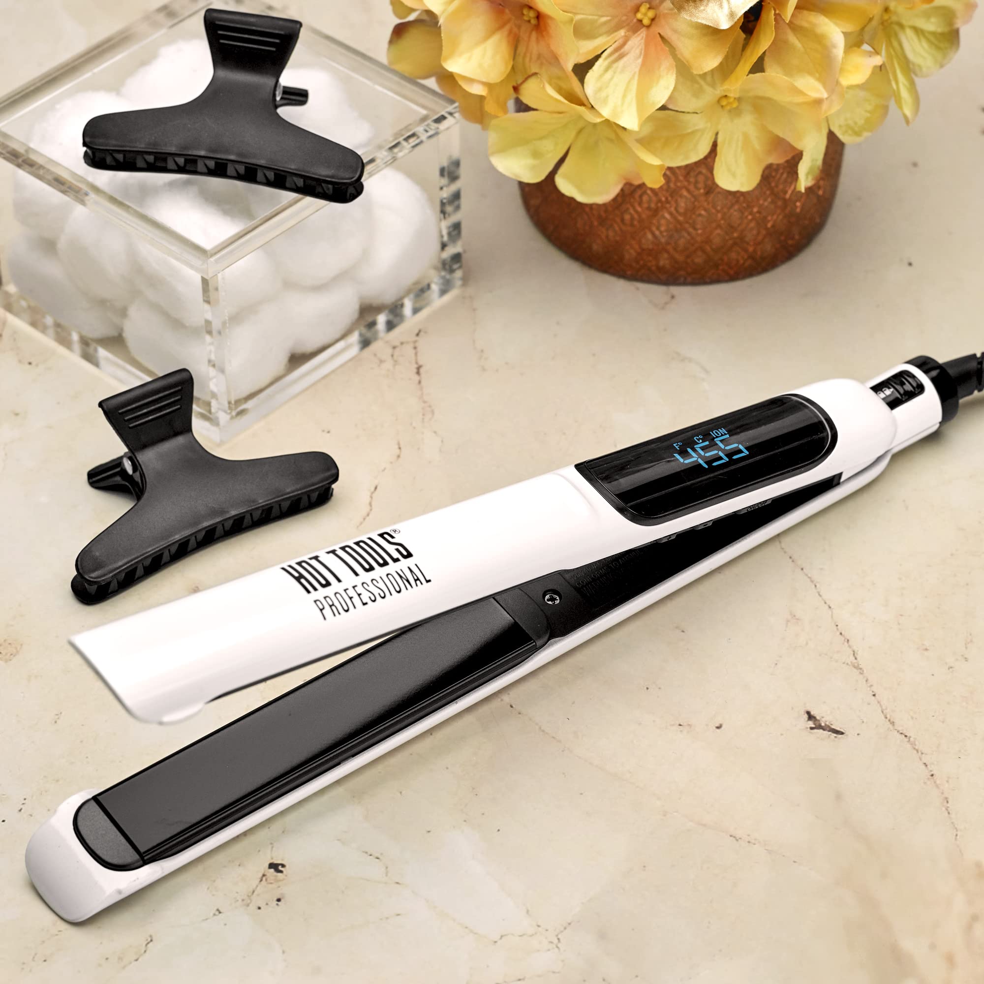Hot Tools Pro Artist Nano Ceramic Flat Iron floating plates enable precise styling.