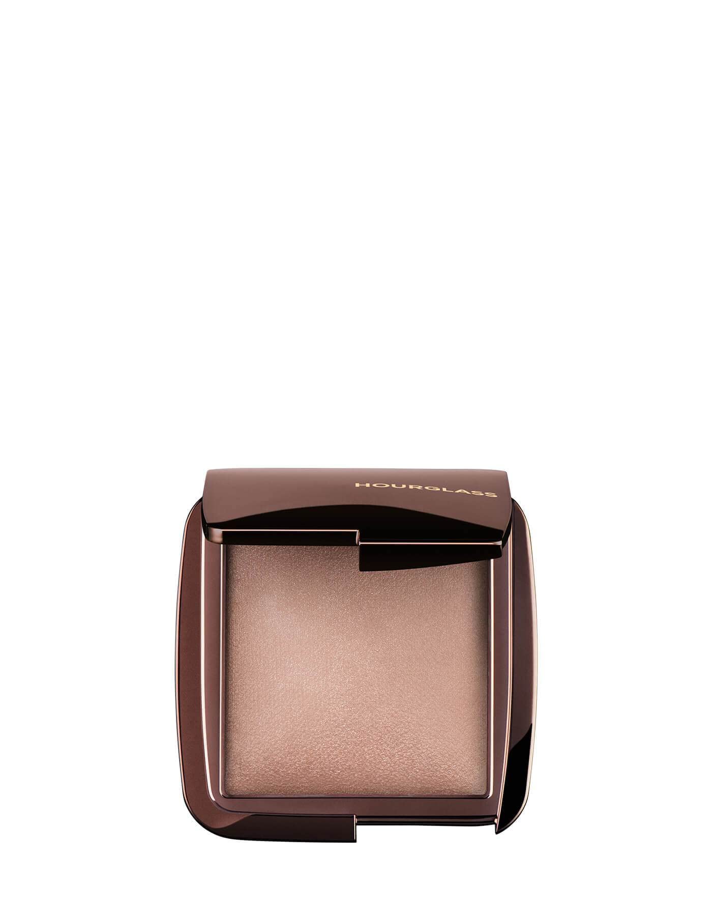 Hourglass Mini Dim Light compact closeup shows soft luminosity for refined glow.