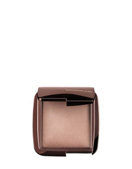 Hourglass Mini Dim Light compact closeup shows soft luminosity for refined glow.