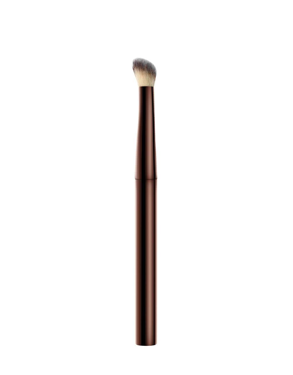 Hourglass Vanish Concealer Brush handle detail highlights weighted metal grip for pro-level control.