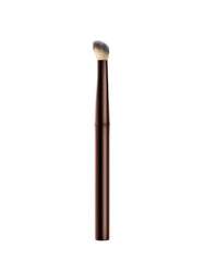 Hourglass Vanish Concealer Brush handle detail highlights weighted metal grip for pro-level control.