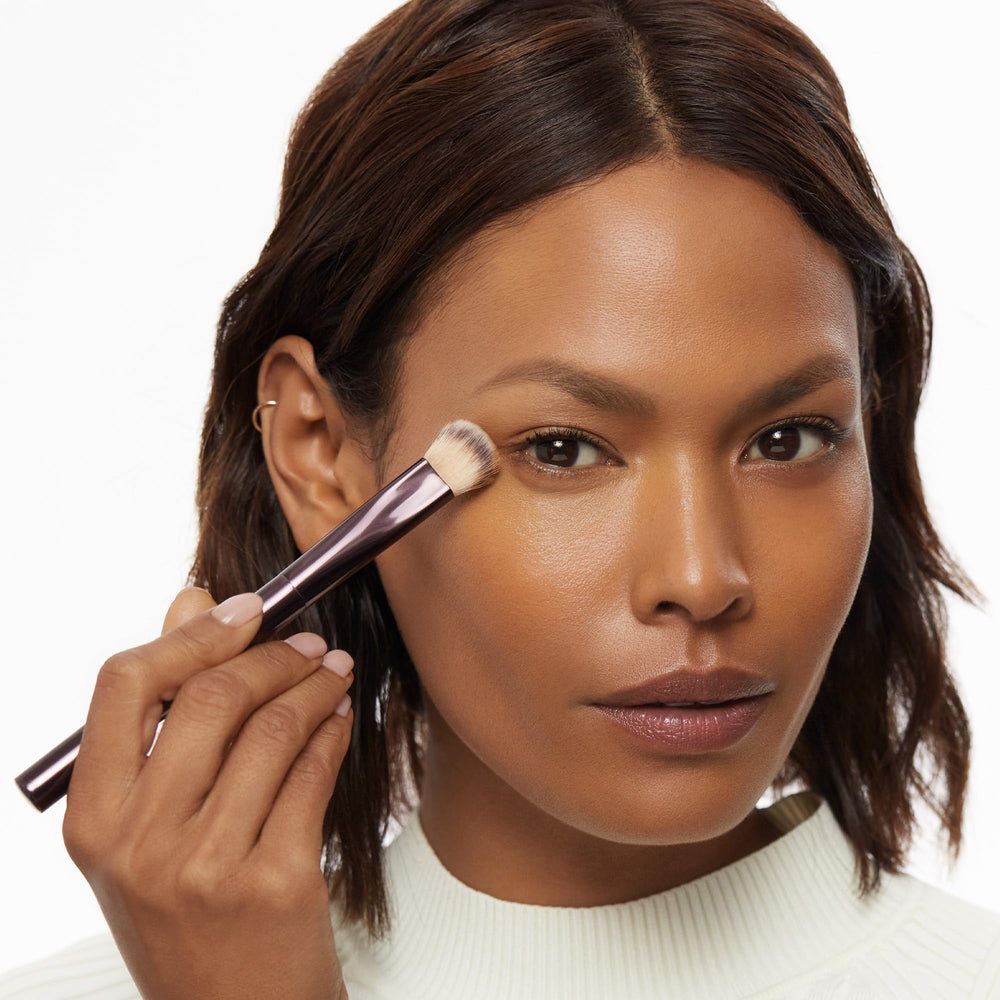Hourglass Vanish Concealer Brush usage across liquid, cream, and powder formulas for versatile makeup application.