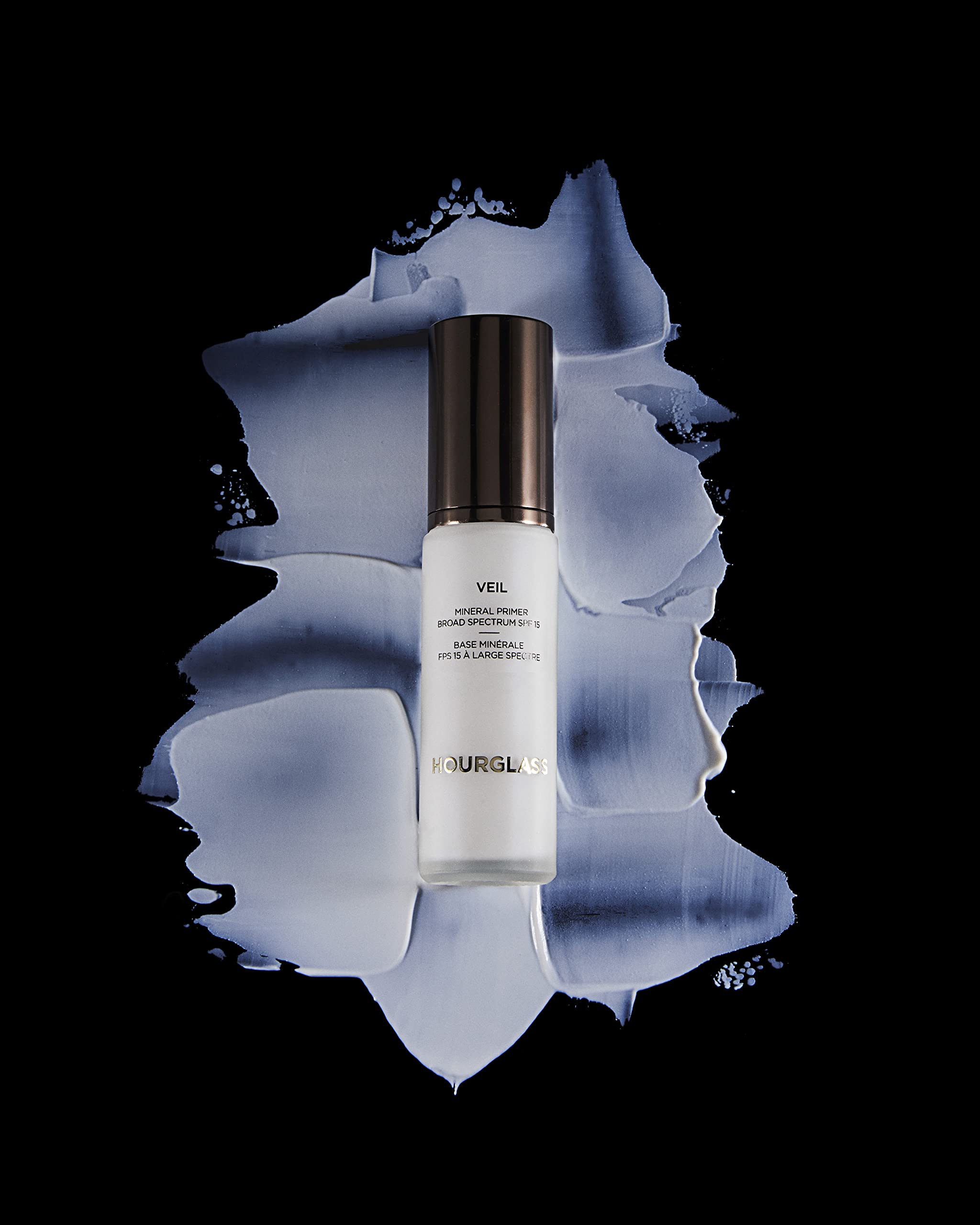 Hourglass Veil Mineral Primer long wear makeup close-up shows foundation gliding on and lasting.