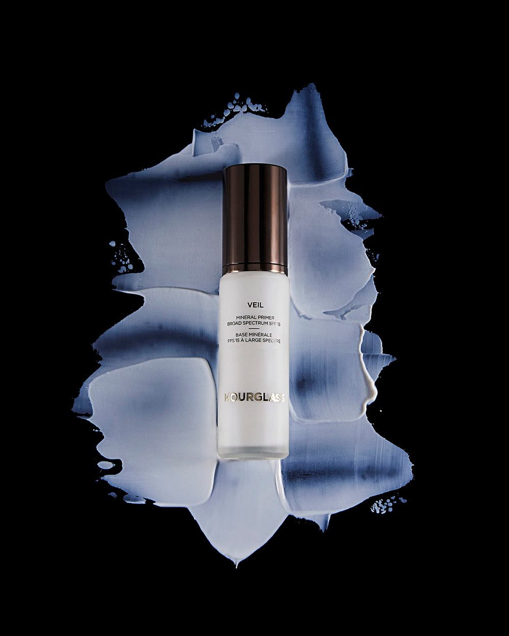 Hourglass Veil Mineral Primer long wear makeup close-up shows foundation gliding on and lasting.