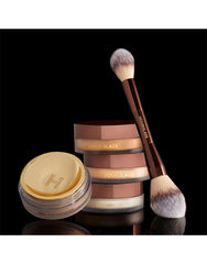 Hourglass Veil Translucent Setting Powder swatch highlights universal translucency for all skin tones.