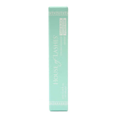 House of Lashes dark-adhesive-bottle-lid-open demonstrates dark lash-line blending with eyeliner.