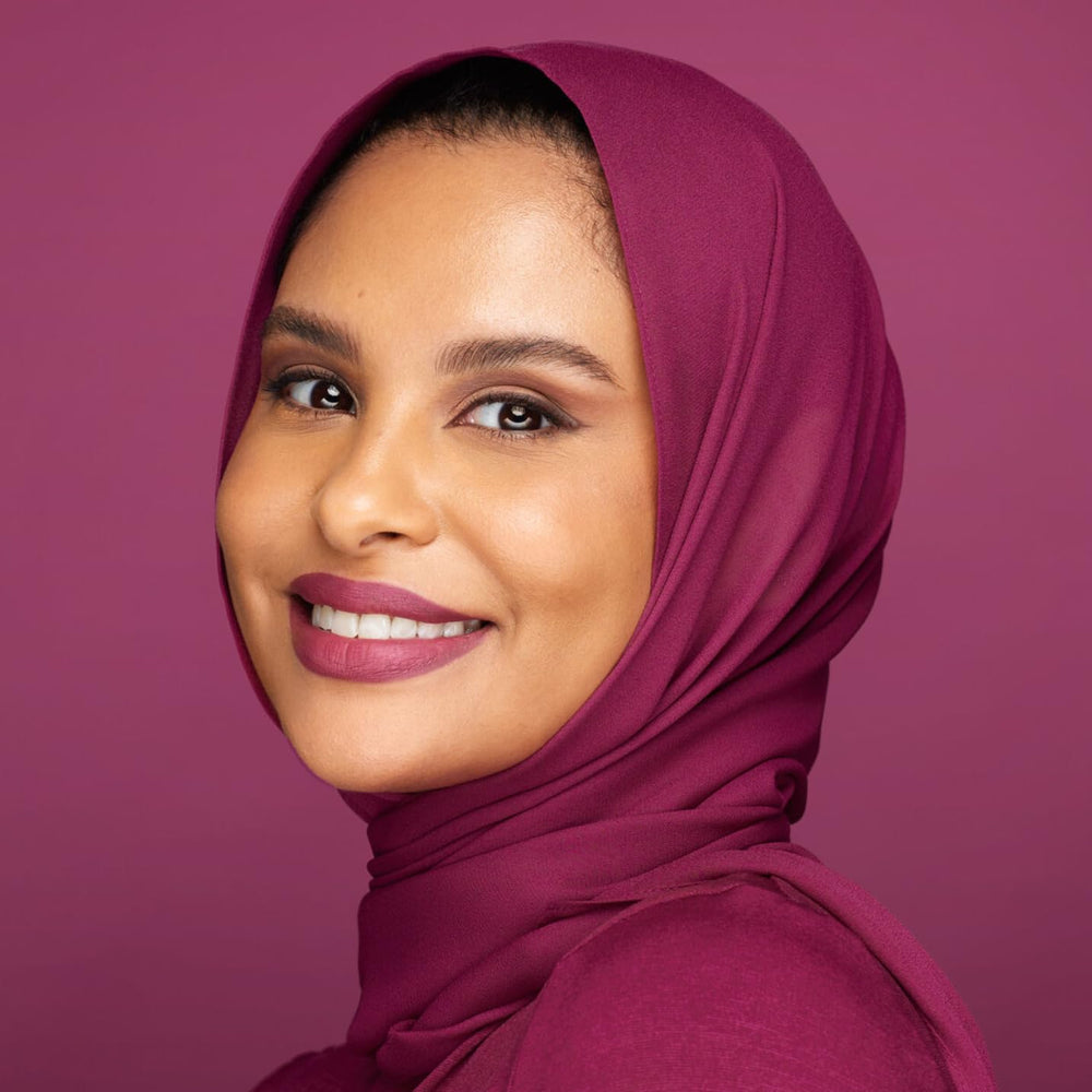 Huda Beauty Trophy Wife lipstick tube cap with sleek design.