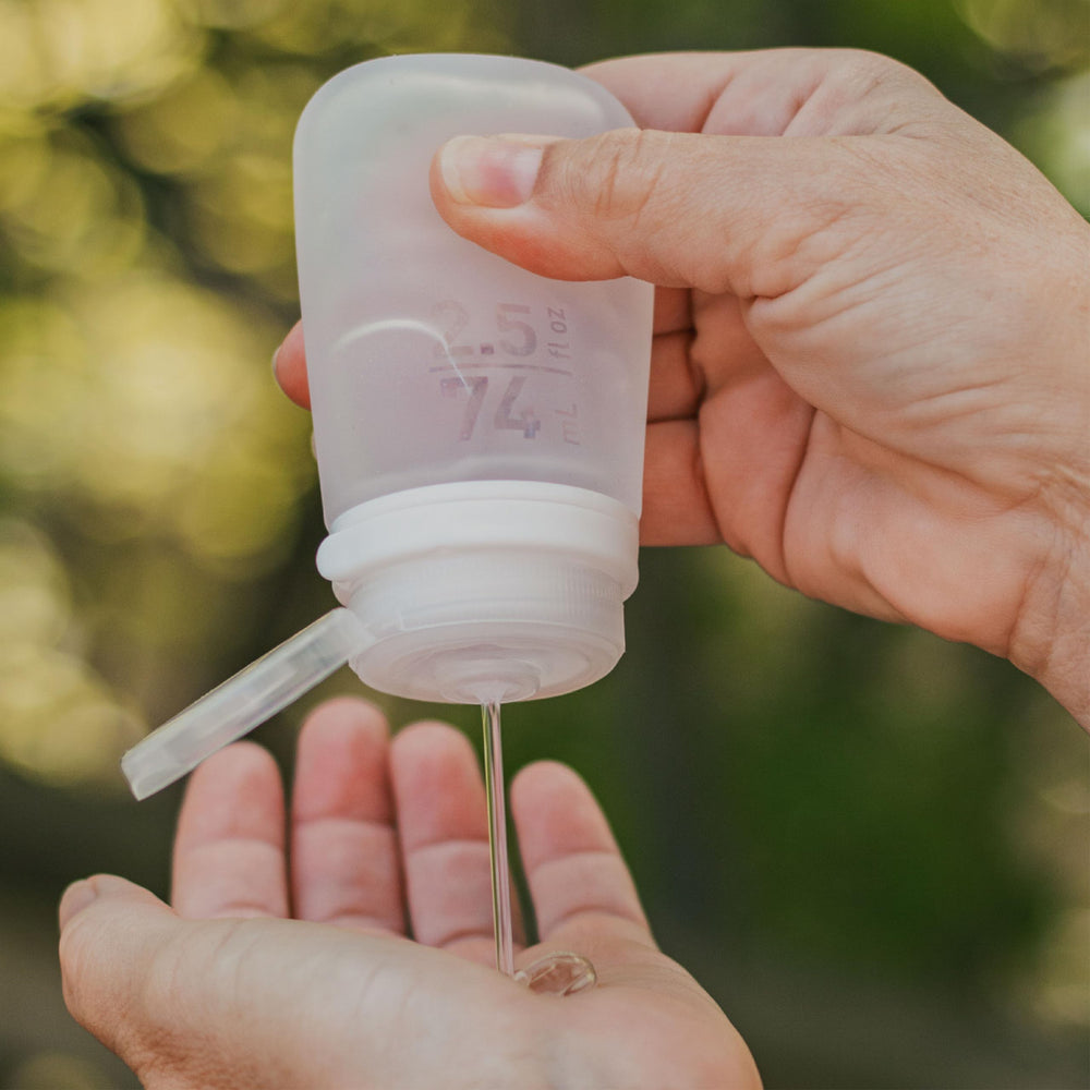 humangear GoToob+ locking lid focuses on leak-free security during flights and hikes.