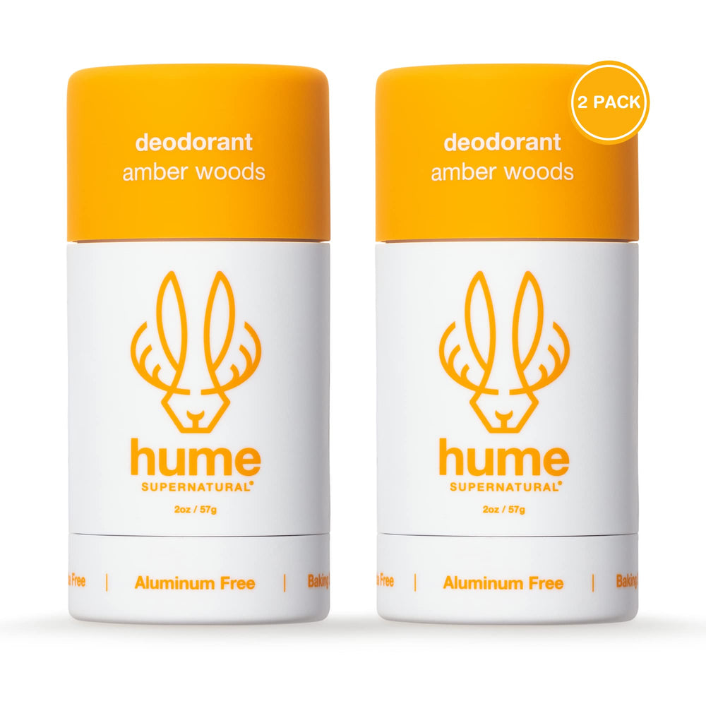 HUME SUPERNATURAL Amber Woods deodorant stick close-up showing aluminum-free formula for fresh underarms.
