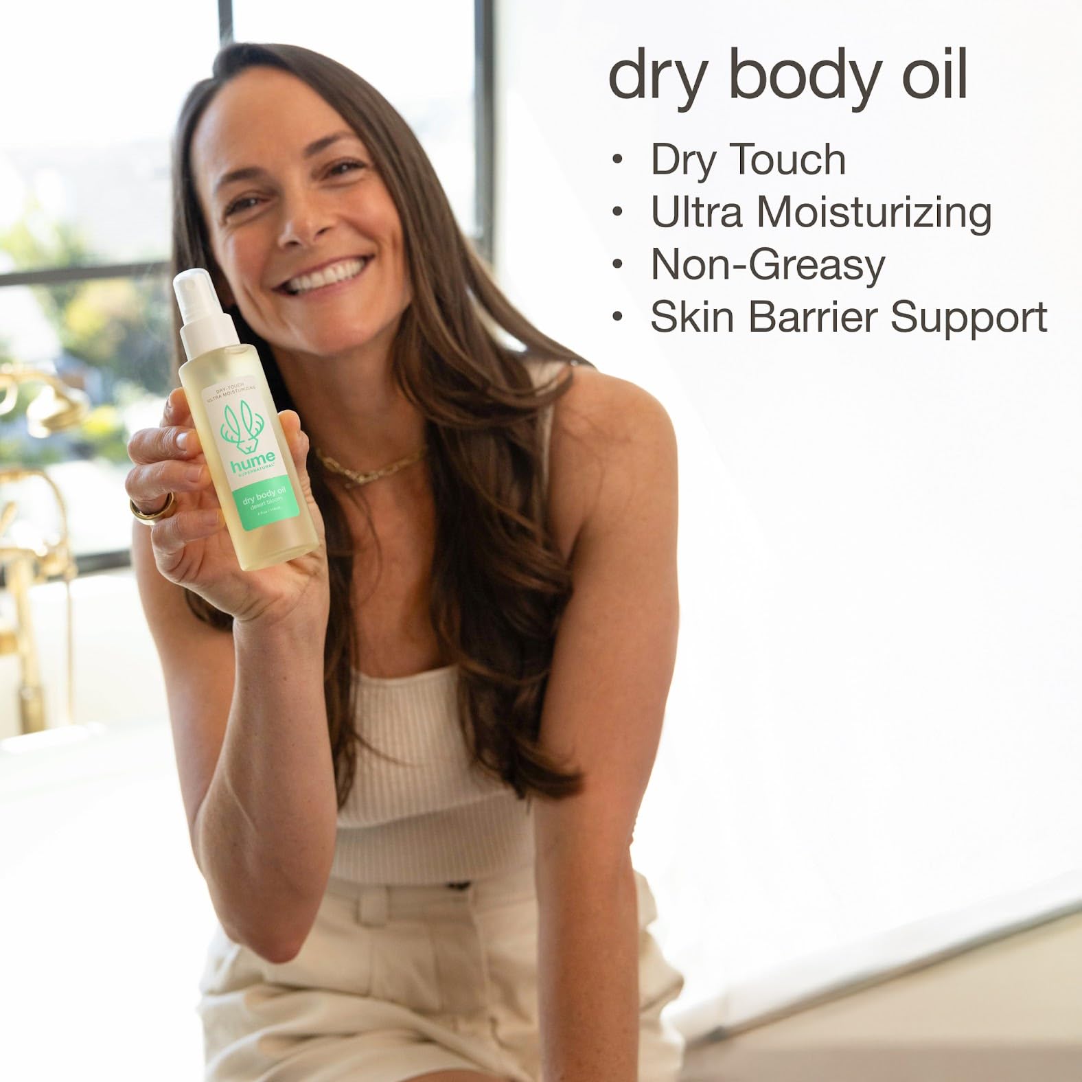 Hume Supernatural dry body oil spray non-greasy finish feels smooth.