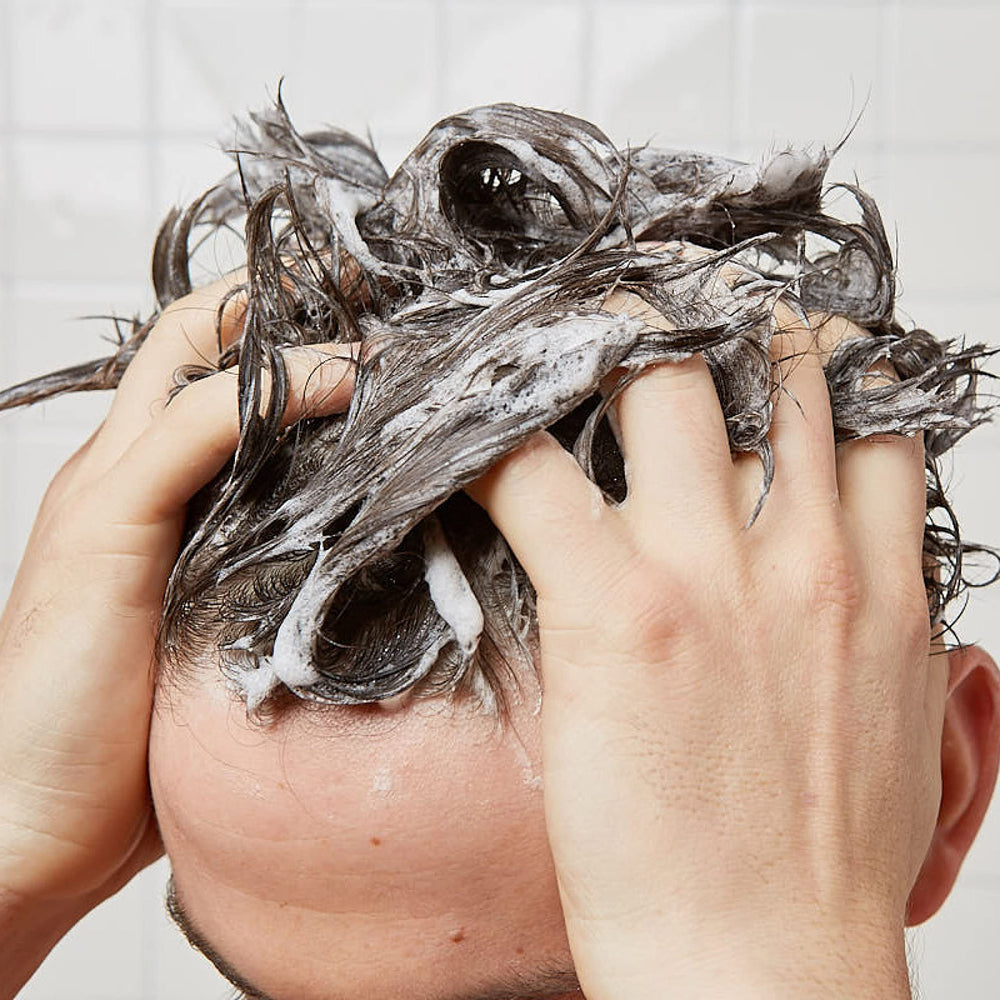 Huron shampoo vitamins E and B7 boost elasticity and fullness visuals.