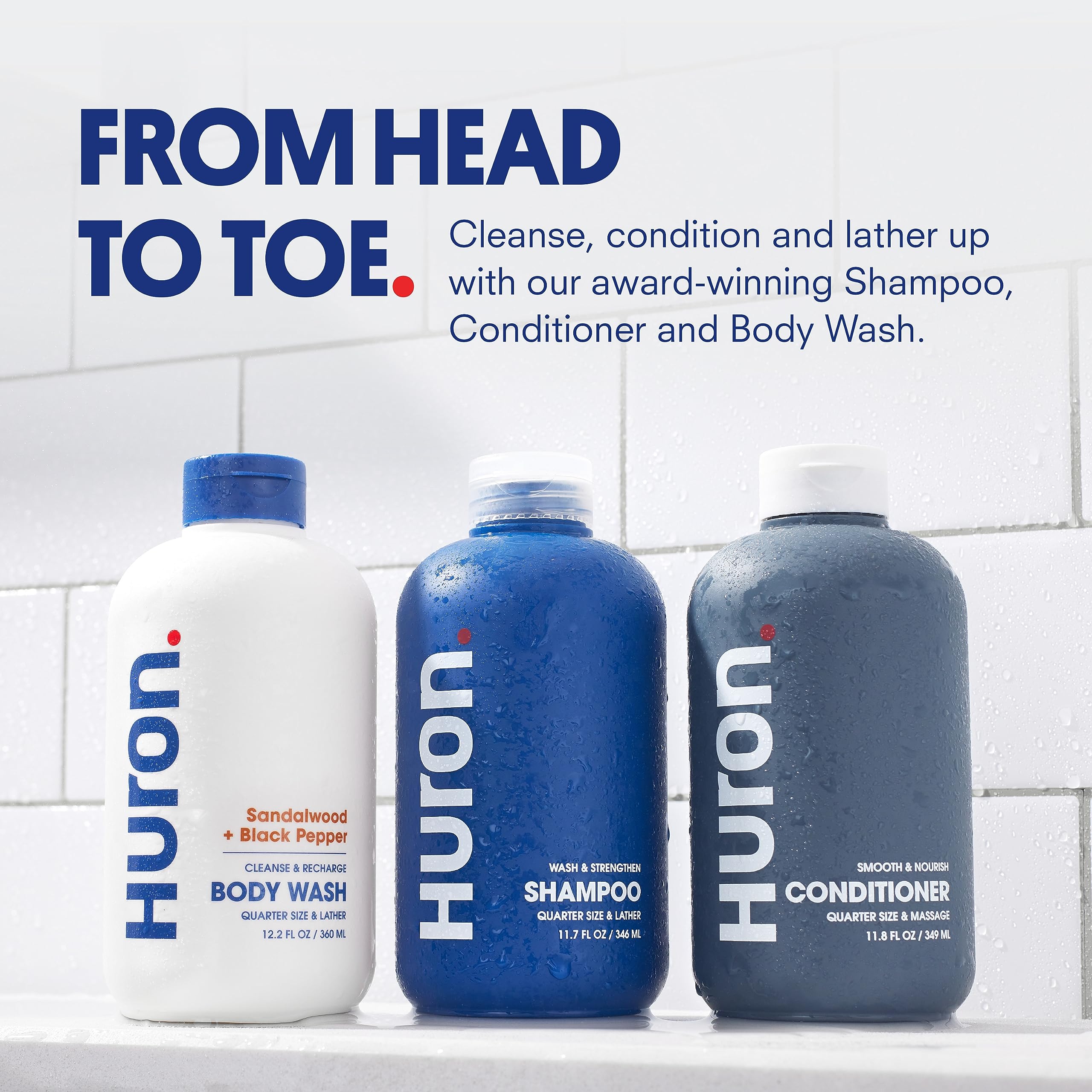 Huron Shower Kit conditioner bottle highlights nourishing care for dry, frizzy hair.