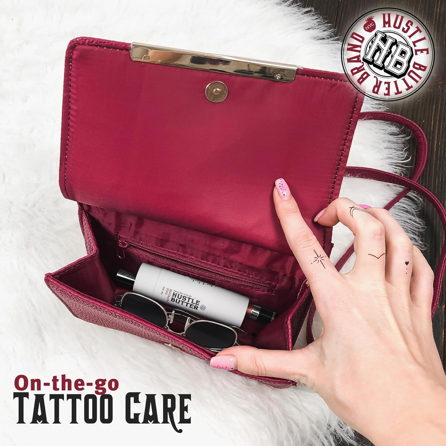 Hustle Butter Deluxe tattoo balm stick application demonstrates smooth glide and targeted care.