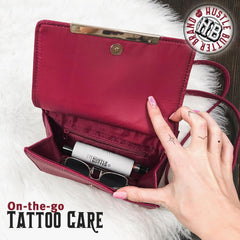 Hustle Butter Deluxe tattoo balm stick application demonstrates smooth glide and targeted care.