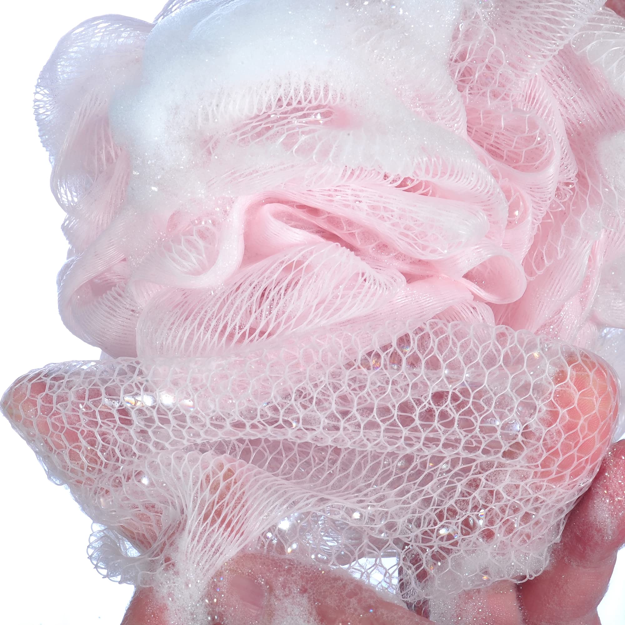 iboodi pink mesh bath sponge in use with shower gel for pampering cleanse