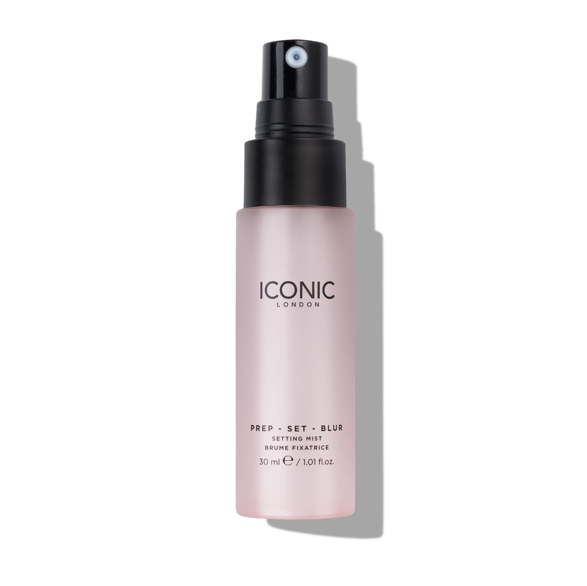 Iconic London Prep Set Blur mist application demonstrates even spray for lasting wear.