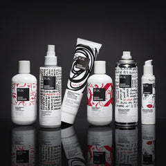Hair close-up with IGK Crybaby delivering sleek shine and frizz reduction.