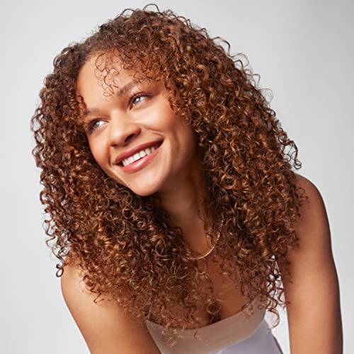 IGK GOOD SPIN finish on damp hair promises nourished curls.