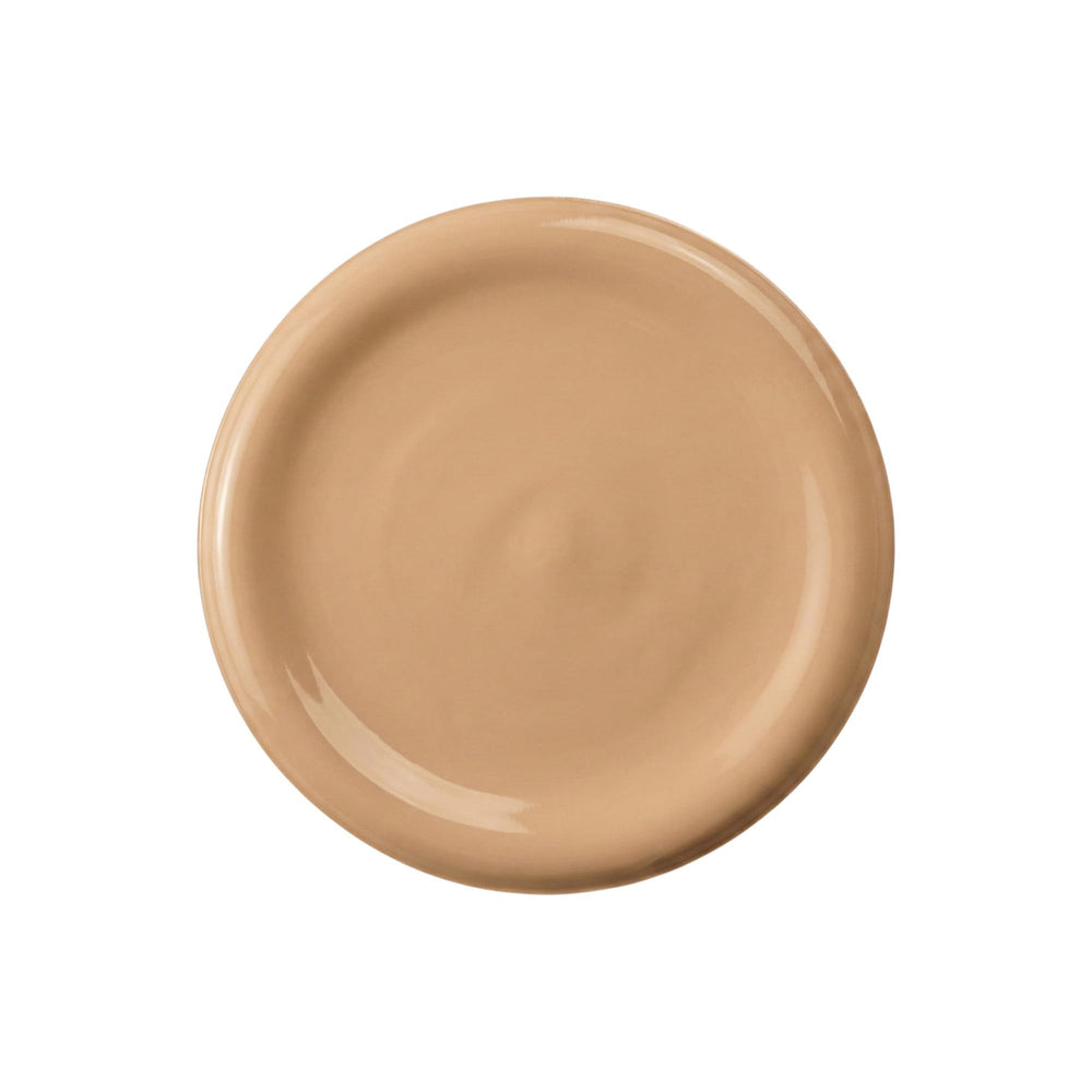 Il Makiage Woke Up Like This foundation texture swirl demonstrates buildable coverage and skin-friendly formula.