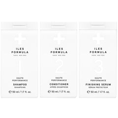 ILES FORMULA mini shampoo bottle demonstrates travel-friendly smoothing for frizz-free travels.