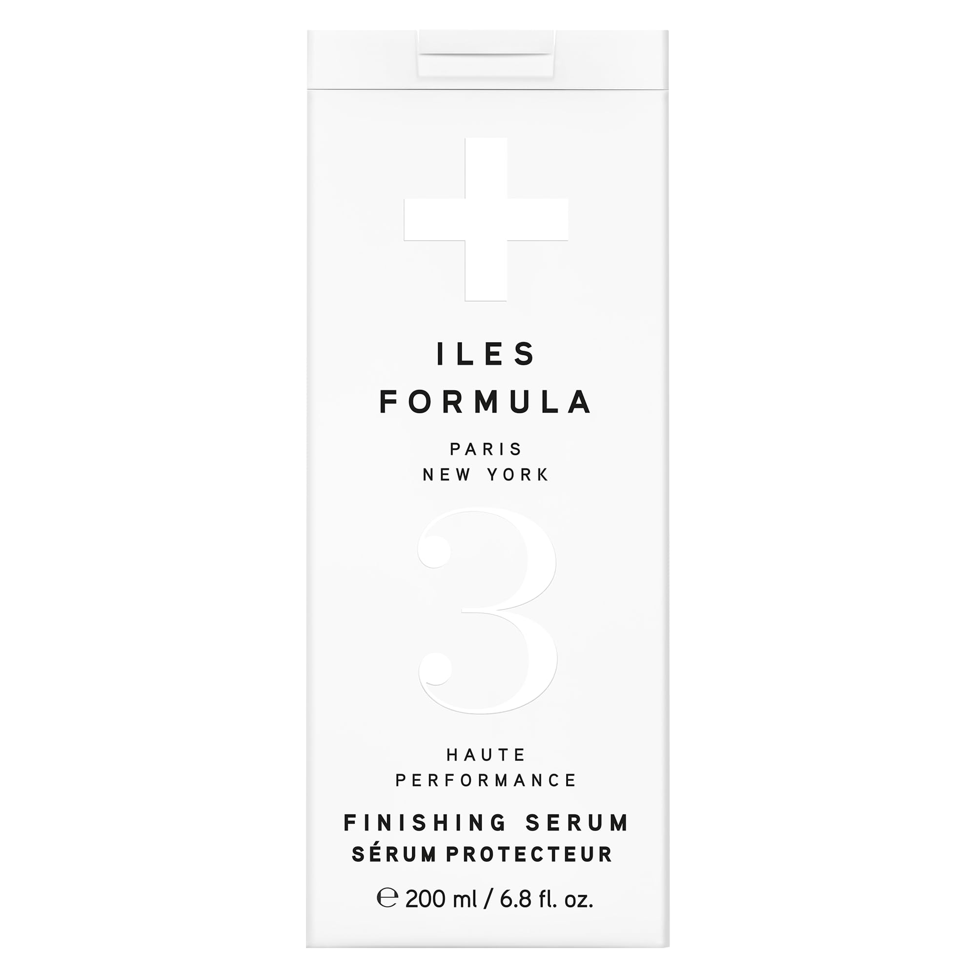 ILES FORMULA Weightless Styling Cream bottle on vanity showing heat protection for sleek blowouts.