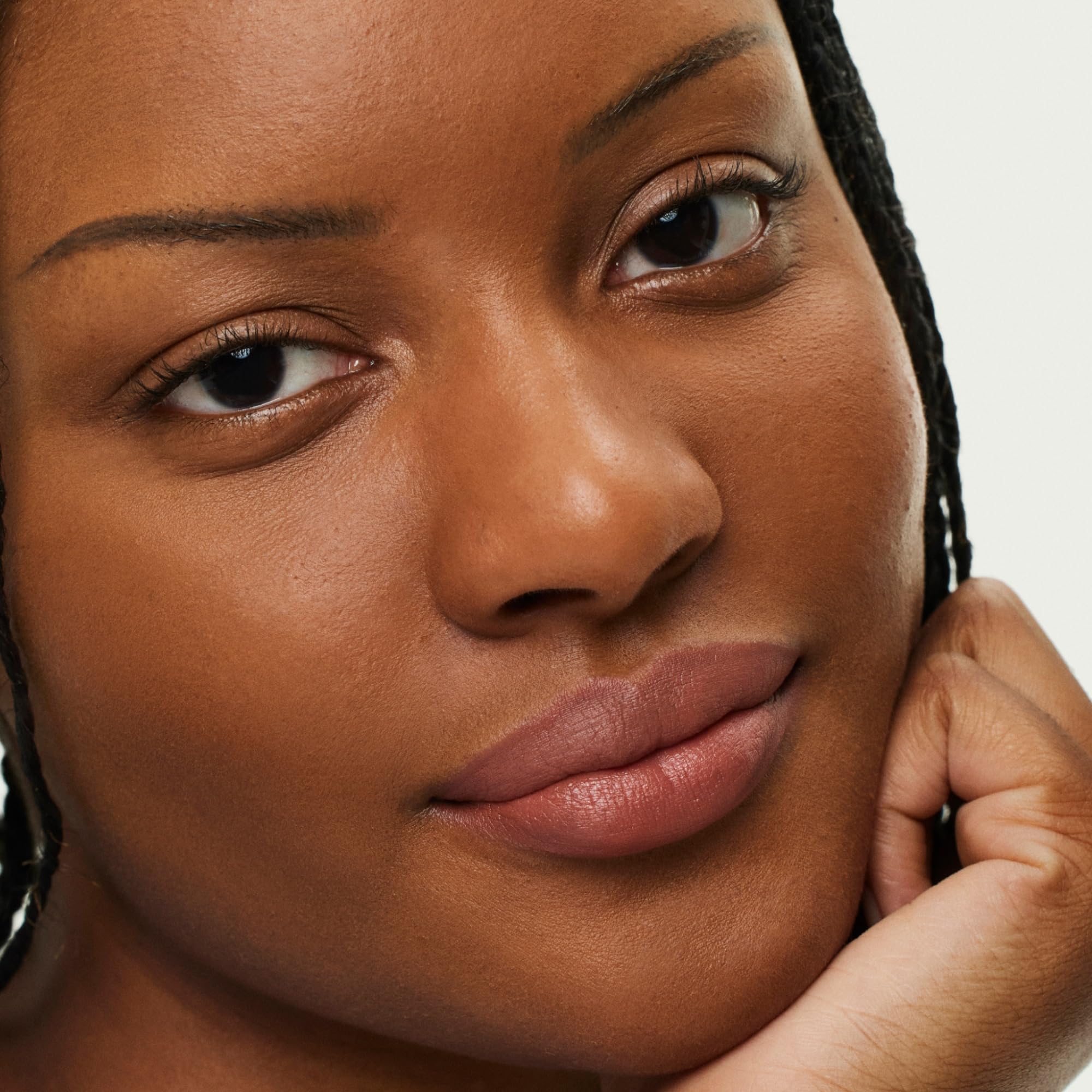 Lip swatch demonstrates hydrated plump look in Earthen shade