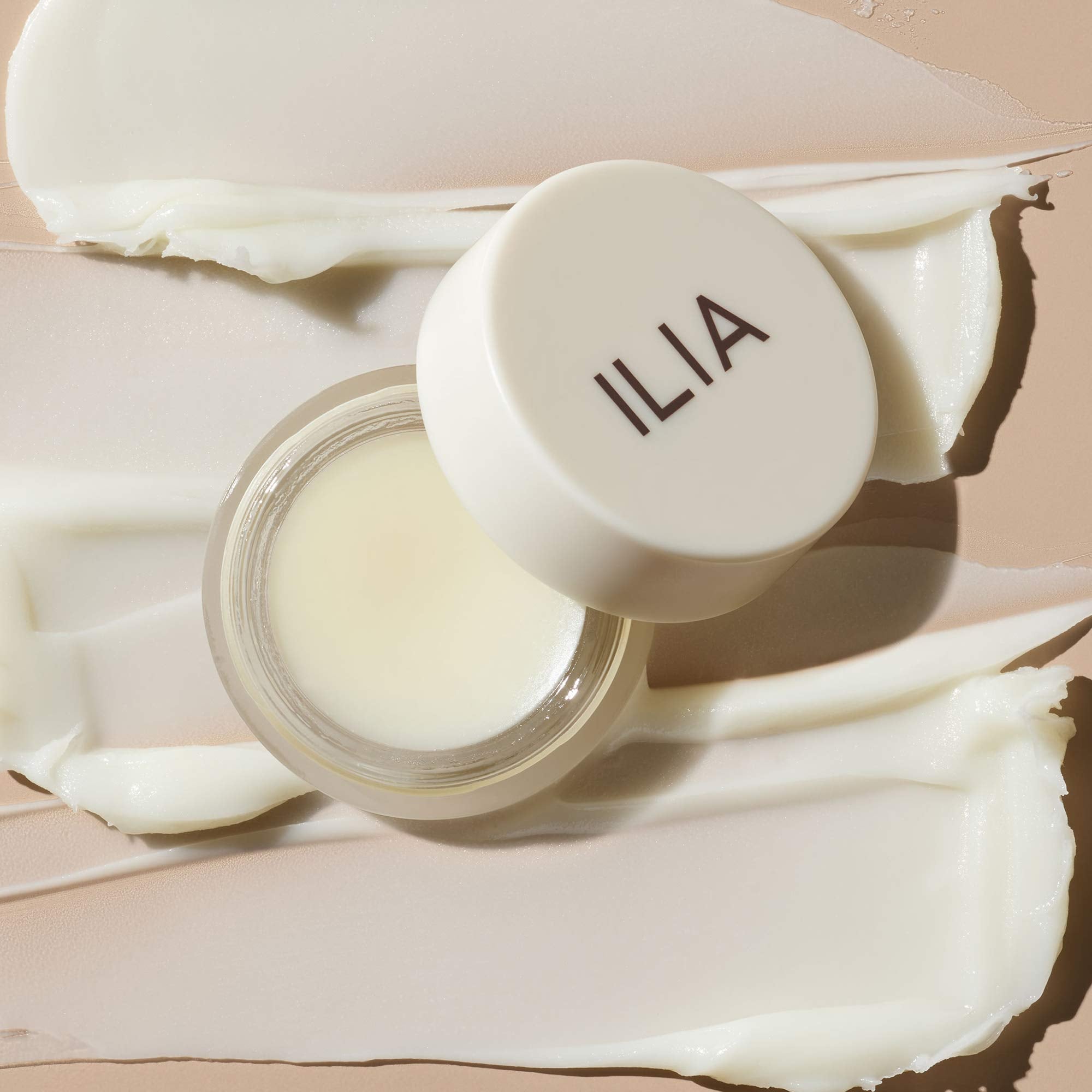ILIA Lip Wrap Overnight Mask closeup-texture — creamy formula cushions lips during application.