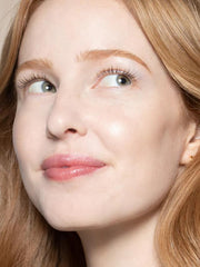ILIA Multi-Stick golden glow on cheeks highlights natural light.