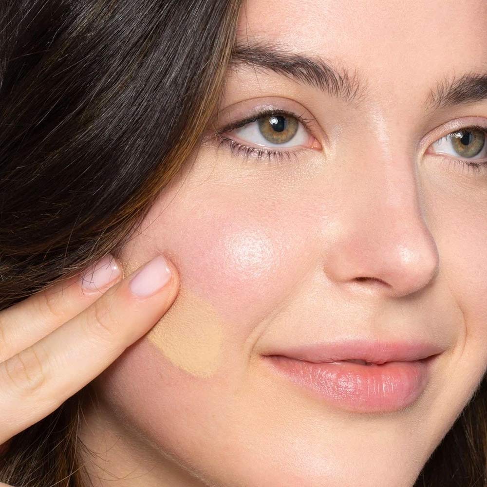 ILIA True Skin Serum Foundation swatch on arm showcases buildable coverage.