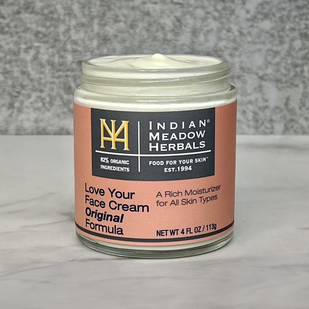 Indian Meadow Herbals Love Your Face Cream jar closeup reveals a creamy, rich texture for daily use.