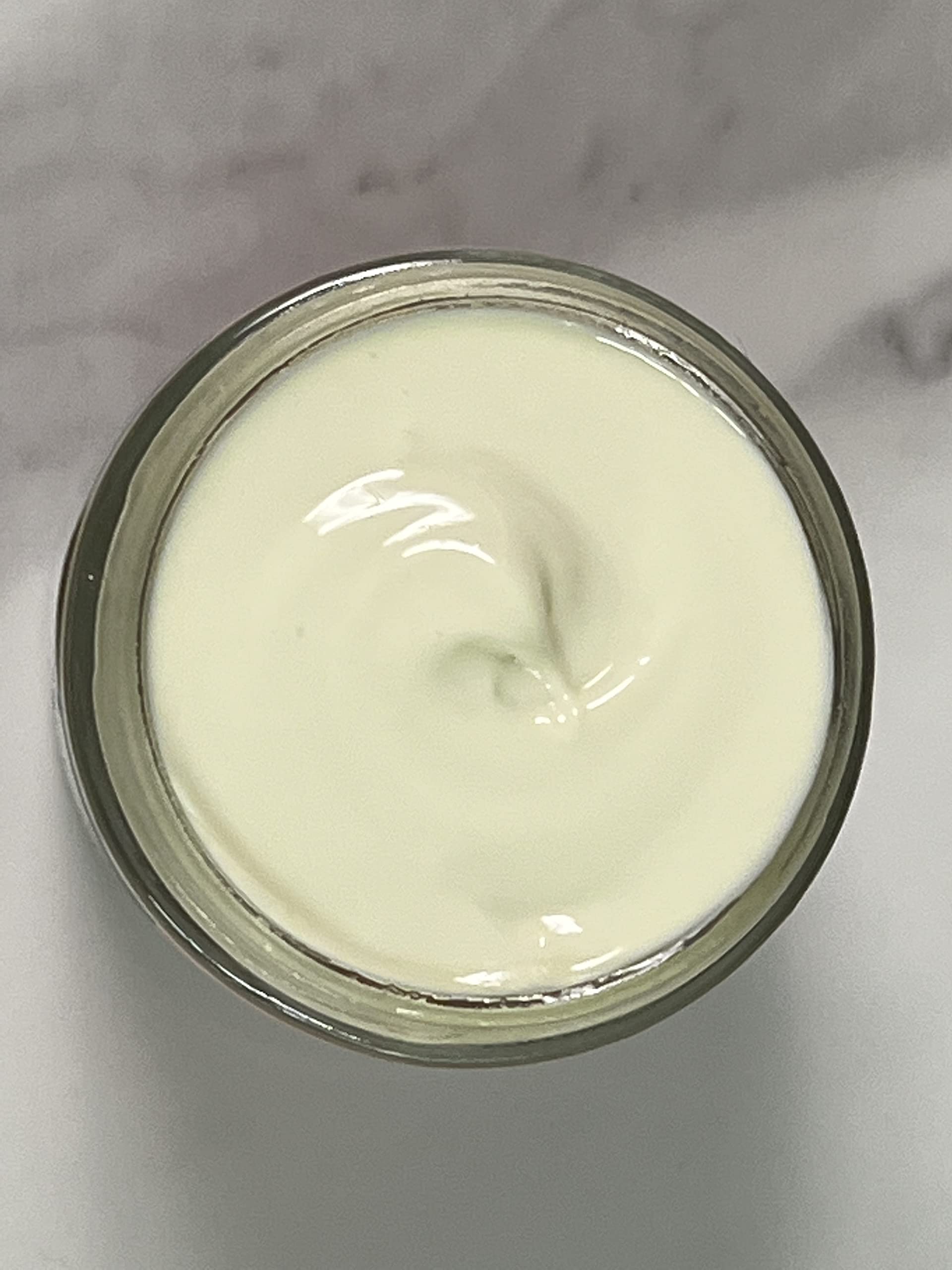 Indian Meadow Herbals Love Your Face Cream swirl on skin demonstrates deep penetrating hydration.