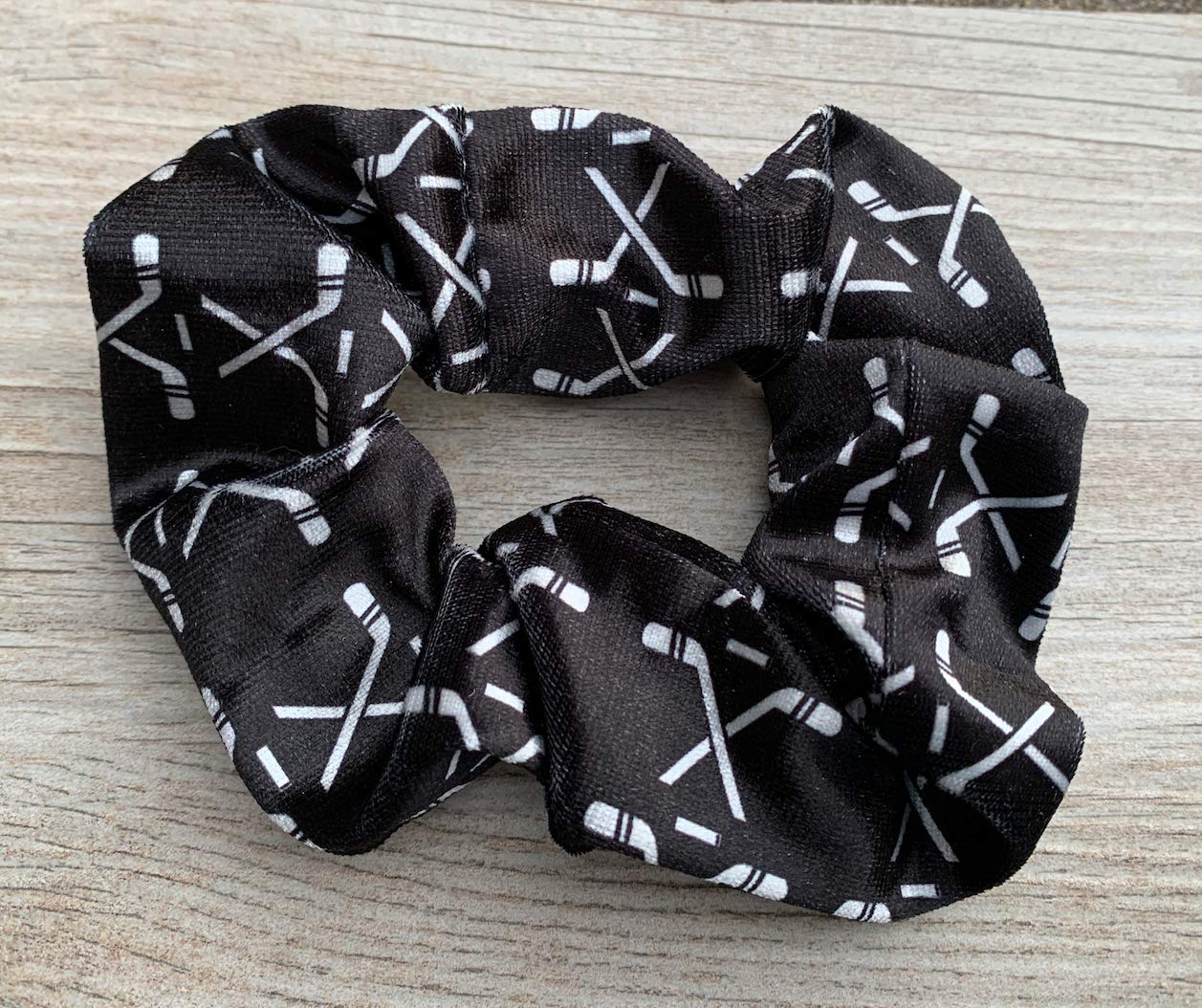 Infinity Collection hockey scrunchie white worn on ponytail for sport-ready style