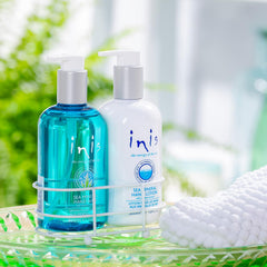 Inis Energy of the Sea hand lotion bottle closeup highlights rich moisture from shea and oils.