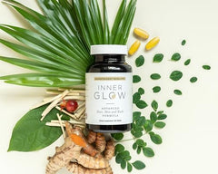 Inner Glow bottle on wood desk for easy daily beauty routine