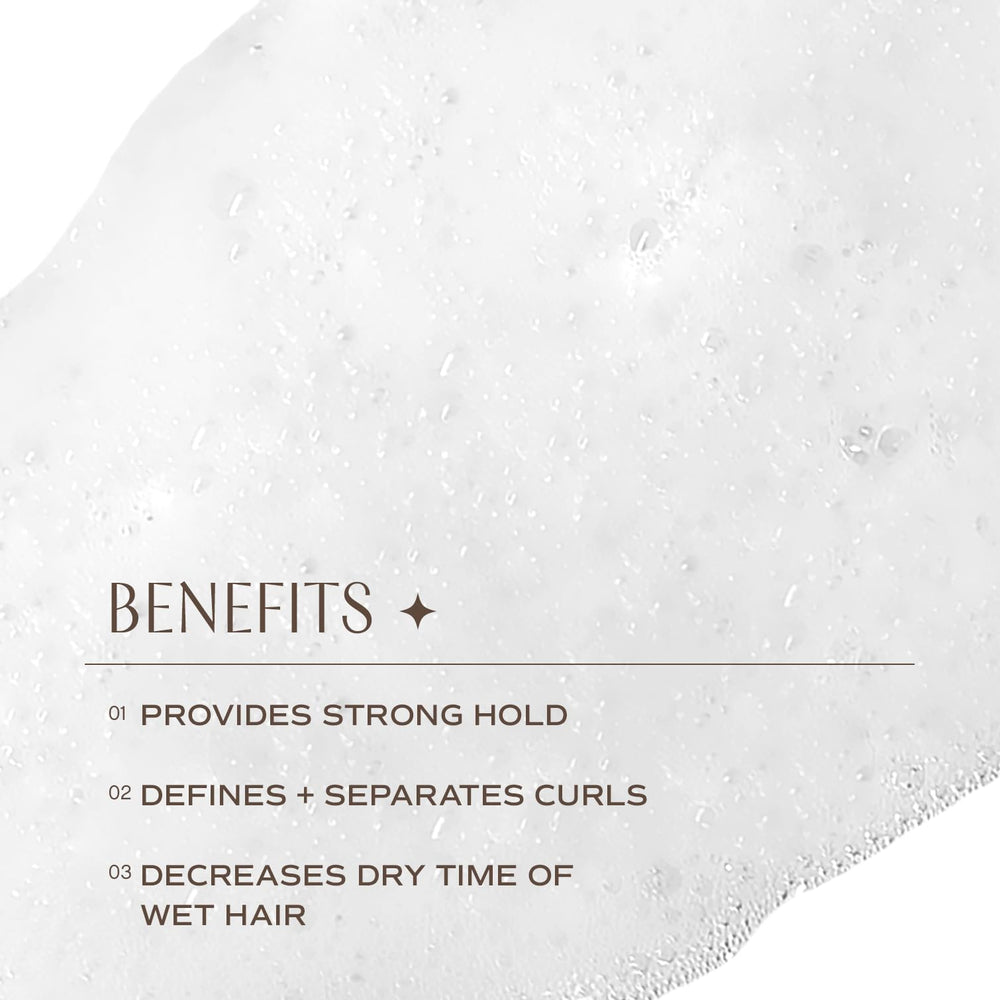 Applying INNERSENSE I Create Definition Styling Foam to wet hair.