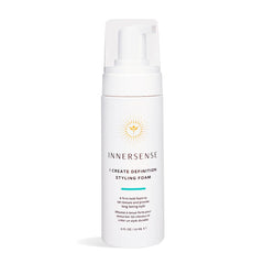 INNERSENSE I Create Definition Styling Foam bottle on a wooden vanity.