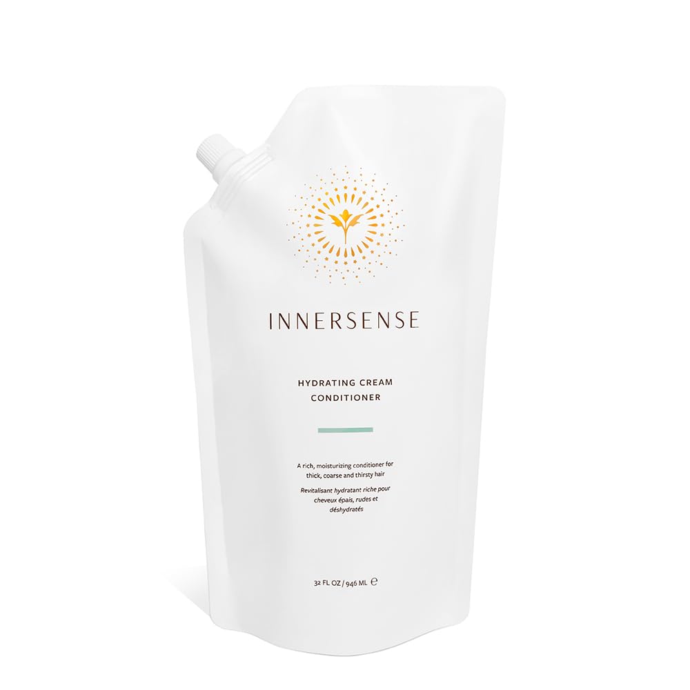 INNERSENSE Natural Hydrating Cream Conditioner bottle close-up for deep moisture and frizz control.