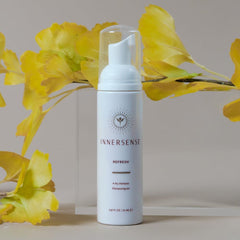 INNERSENSE Natural Refresh Dry Shampoo citrus fragrance close-up highlights orange and tangerine notes.