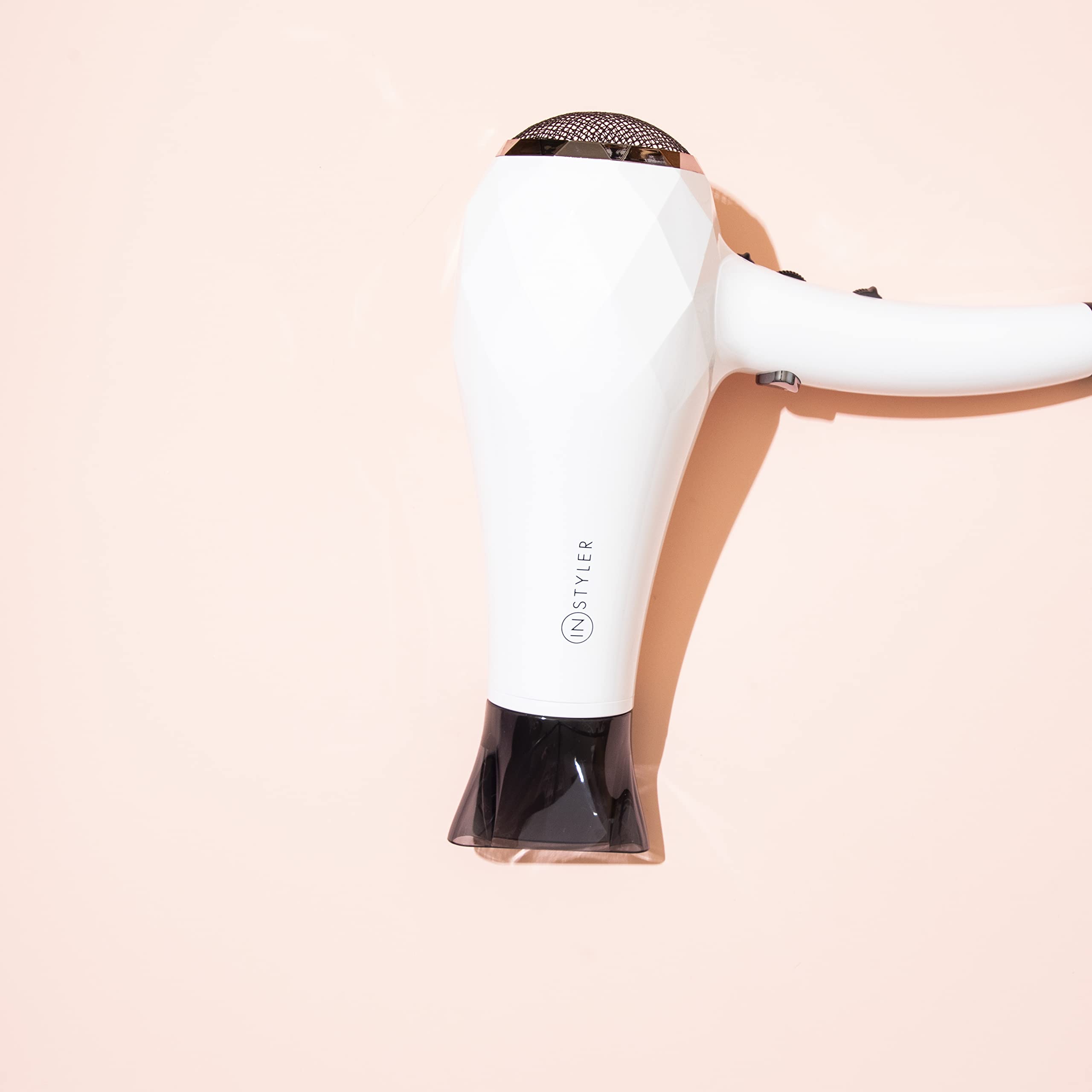 InStyler Turbo Ionic Blow Dryer diffusing air with diffuser attachment for curl bounce.