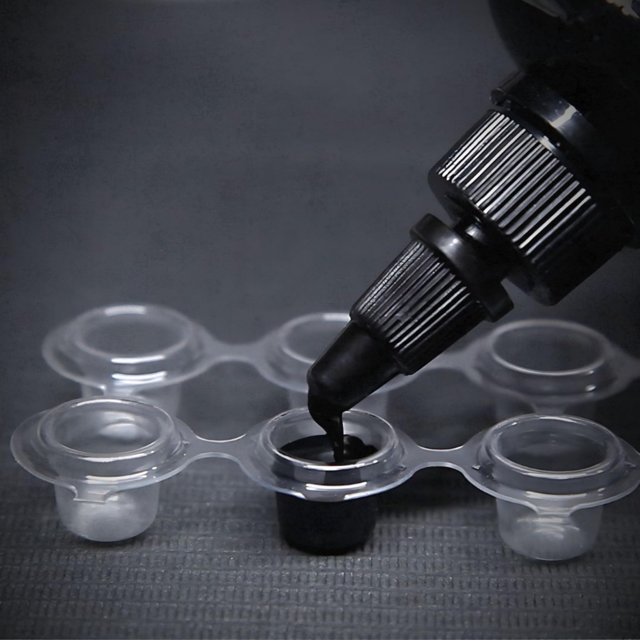 Intenze Black Label ink bottle-cap closeup – secure cap supports hygienic sessions.